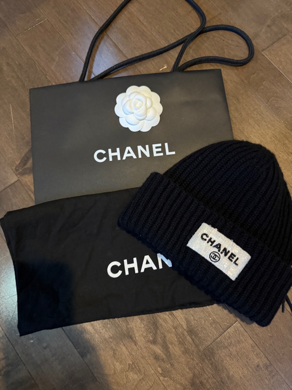 CHANEL Black Ribbed Knit Cuff Beanie with iridescent Logo Patch